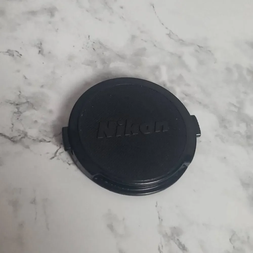 Nikon 52m.‎ Camera Cap